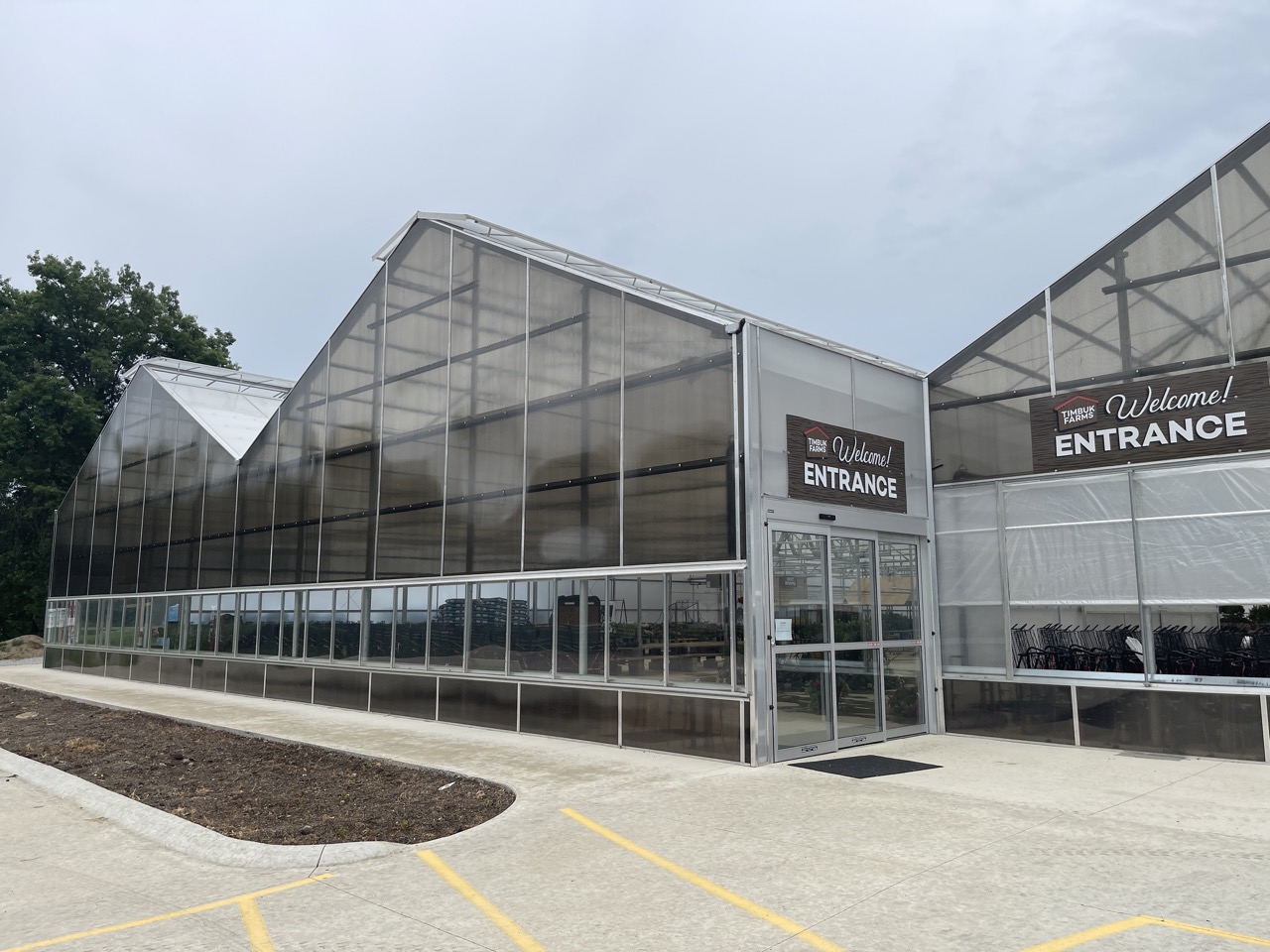 Conley's greenhouse at a nursery or garden center — retail-facing structure with plants on display